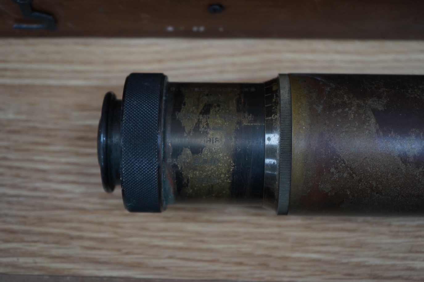 A First World War telescope gunsight by W. Watson & Sons Ltd., London, stamped S.S. Telescope x8 3348, and dated 1918, in its original pine case, sight 52cm long, case 68.5cm long. Condition - fair.